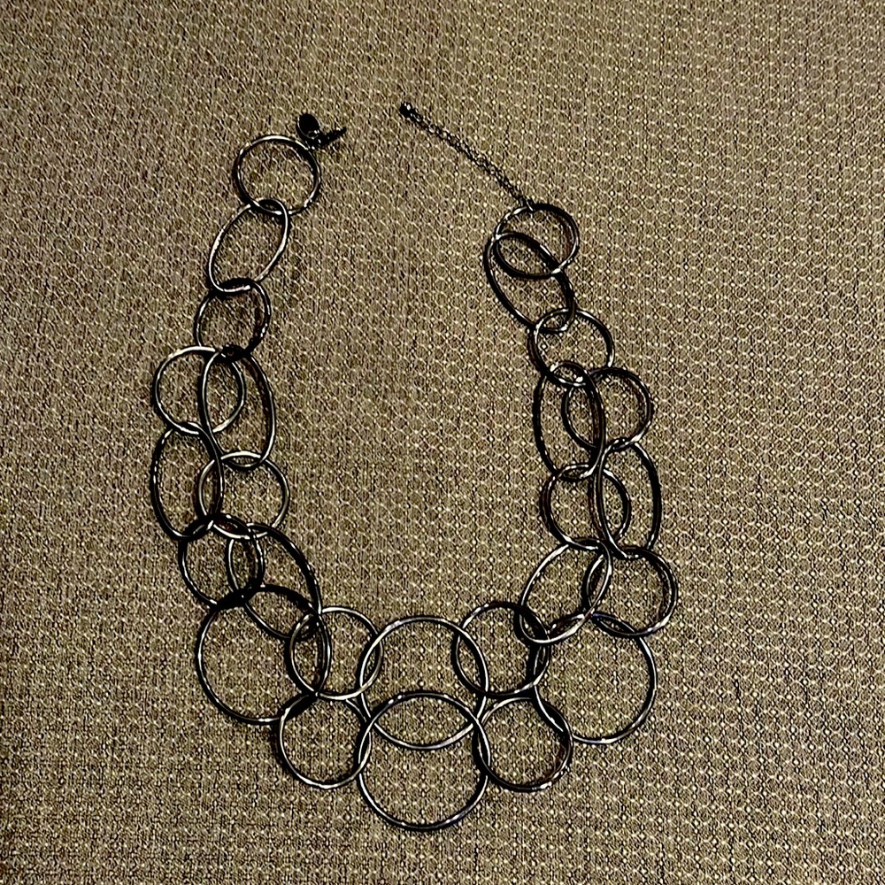 We go round in circles. Very cute necklace.